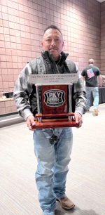 BCO Willie Flores holding his Truck Beauty Championship trophy